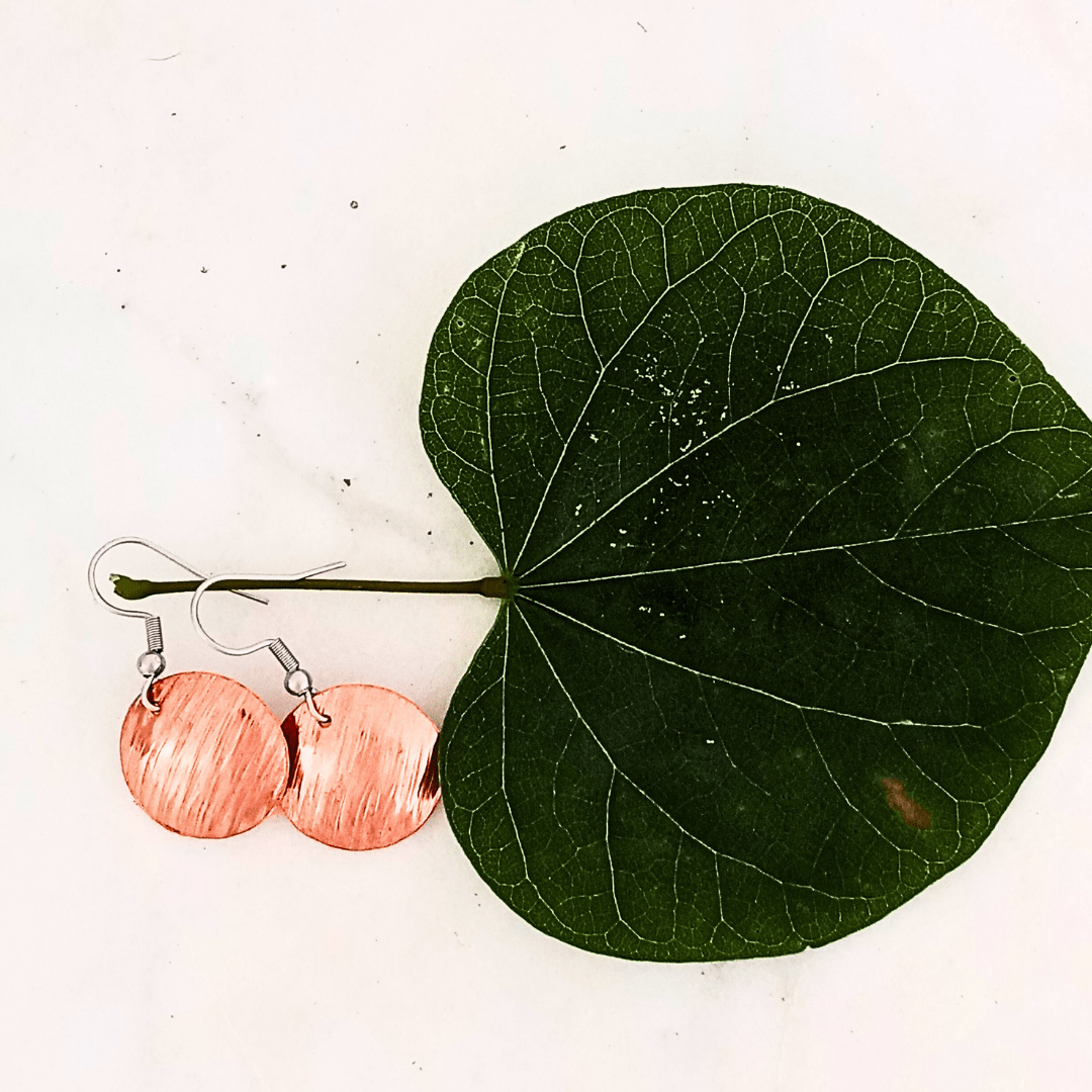 Cherokee Copper Storm earrings on leaf