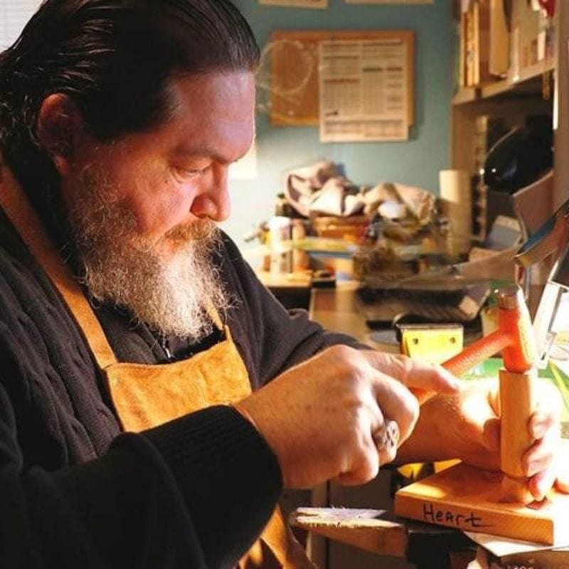 Cherokee Coppersmith Greg Stice at his jewelry bench