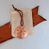 Copper star ornament with bag and ribbon, 2024