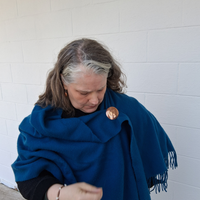 Cherokee Nation brooch on a shawl