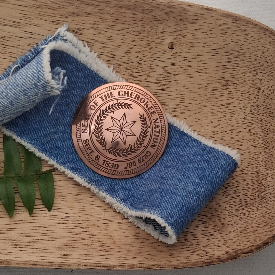 Cherokee Nation Seal Brooch in a wooden bowl