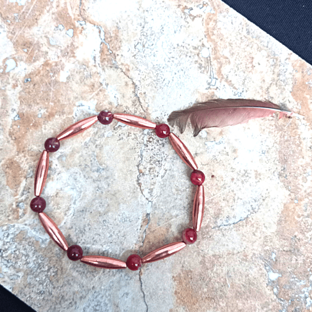 Cardinal Unali'i bracelet with feather on stone